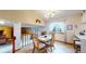 Cozy dining room with stylish chandelier and adjacent kitchen area at 17588 E Dickenson Pl, Aurora, CO 80013
