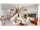 Warm dining room featuring wooden furniture and a view of the staircase and living spaces at 17588 E Dickenson Pl, Aurora, CO 80013