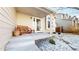 Charming front porch with a wooden bench, concrete steps, and decorative landscaping at 17588 E Dickenson Pl, Aurora, CO 80013