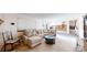 Inviting living room with plush seating and an open floor plan to the dining area at 17588 E Dickenson Pl, Aurora, CO 80013