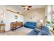 Inviting living room with vaulted ceilings, a ceiling fan, and an abundance of natural light at 17588 E Dickenson Pl, Aurora, CO 80013
