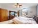 Bright and airy main bedroom with a large window and a traditional-style dresser at 17588 E Dickenson Pl, Aurora, CO 80013