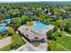 Aerial view of community pool, clubhouse, and tennis courts at 4626 E Links Dr, Centennial, CO 80122