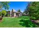 Spacious backyard with a patio, seating area, and lush lawn offers a perfect space for outdoor gatherings at 4626 E Links Dr, Centennial, CO 80122