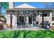 Outdoor patio with pergola, gas grill, and dining set, perfect for entertaining and relaxation at 4626 E Links Dr, Centennial, CO 80122
