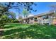 Expansive backyard featuring mature trees, a large lawn, and a pergola-covered patio at 4626 E Links Dr, Centennial, CO 80122
