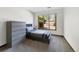 Cozy bedroom with neutral tones, dresser, and a window with natural light at 4626 E Links Dr, Centennial, CO 80122