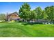Community Entrance sign surrounded by lush landscaping, marking a welcoming entry to the neighborhood at 4626 E Links Dr, Centennial, CO 80122