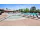 Large community pool and hot tub with plenty of seating provides residents with a refreshing recreational space at 4626 E Links Dr, Centennial, CO 80122