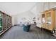 Bright living room showcasing vaulted ceiling, large windows, neutral walls, and stylish decor at 4626 E Links Dr, Centennial, CO 80122