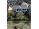 Aerial view of a home with a backyard, deck, patio, and mature trees at 10259 Fairgate Way, Highlands Ranch, CO 80126