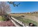 A sprawling backyard with a wooden fence, offering plenty of space for outdoor activities at 10259 Fairgate Way, Highlands Ranch, CO 80126