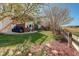 Lush backyard with a patio, hot tub, and verdant landscaping at 10259 Fairgate Way, Highlands Ranch, CO 80126