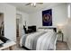 Bedroom with ceiling fan, bedside table, and attached ensuite bathroom at 10259 Fairgate Way, Highlands Ranch, CO 80126