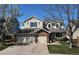 Charming two-story home with a well-manicured lawn and a spacious three-car garage at 10259 Fairgate Way, Highlands Ranch, CO 80126