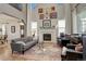 Inviting living room showcasing a fireplace, high ceilings, and stylish decor at 10259 Fairgate Way, Highlands Ranch, CO 80126