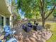 Relaxing backyard deck with outdoor seating, grill, and lush green landscaping at 1052 Northampton Ct, Highlands Ranch, CO 80126
