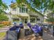 Backyard deck area with comfortable seating and dining options for entertaining at 1052 Northampton Ct, Highlands Ranch, CO 80126