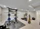 Finished basement includes a home gym with weight training and cardio equipment at 1052 Northampton Ct, Highlands Ranch, CO 80126