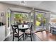 Bright breakfast nook with a round table, overlooking the outdoor patio and landscaped backyard at 1052 Northampton Ct, Highlands Ranch, CO 80126