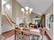 Open concept room, vaulted ceiling, seamlessly connects the dining and living areas at 1052 Northampton Ct, Highlands Ranch, CO 80126