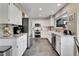 Modern kitchen with white cabinets, granite countertops, and stainless steel appliances at 1052 Northampton Ct, Highlands Ranch, CO 80126