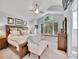 Comfortable bedroom with vaulted ceilings, ceiling fan, large windows, and ample natural light at 1052 Northampton Ct, Highlands Ranch, CO 80126