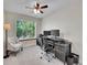A functional office space boasts natural light, modern desk, and comfortable chair at 1052 Northampton Ct, Highlands Ranch, CO 80126