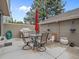 Enclosed back patio area with a stone table and seating at 7049 E Briarwood Cir, Centennial, CO 80112