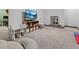 Finished basement with a television, tables and chairs, storage, and carpet at 7049 E Briarwood Cir, Centennial, CO 80112