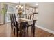 Open dining area with wood floors, chandelier, and sliding door to the backyard at 7049 E Briarwood Cir, Centennial, CO 80112