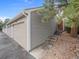 Exterior view of a 2-car garage with driveway and small steps leading to the property at 7049 E Briarwood Cir, Centennial, CO 80112