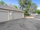 Exterior view of a 2-car garage and driveway of home at 7049 E Briarwood Cir, Centennial, CO 80112