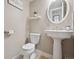 Updated powder room with pedestal sink and neutral decor at 7049 E Briarwood Cir, Centennial, CO 80112