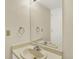 Bathroom featuring vanity with sink, mirror, and neutral color palette at 7707 S Monaco Cir, Centennial, CO 80112