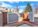 Relax on the patio that includes integrated wood details at 7707 S Monaco Cir, Centennial, CO 80112