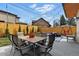 Cozy backyard featuring a patio with dining furniture, a comfortable outdoor lounge area, and a hammock at 428 Pontiac St, Denver, CO 80220