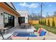 Relaxing backyard with a patio seating area, outdoor lights, and lush green lawn, perfect for entertaining at 428 Pontiac St, Denver, CO 80220