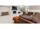 Finished basement featuring a fireplace, staircase, and comfortable seating area with sectional sofa at 428 Pontiac St, Denver, CO 80220