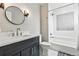 Stylish bathroom featuring modern fixtures, a sleek vanity, and an updated shower-tub combination at 428 Pontiac St, Denver, CO 80220