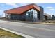 Commercial building with modern architectural elements and large windows on a clear day at 428 Pontiac St, Denver, CO 80220
