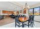 Dining room flows into kitchen, with views of modern cabinets and a spacious island at 428 Pontiac St, Denver, CO 80220