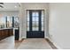 Welcoming foyer features a decorative glass front door and hardwood floors at 428 Pontiac St, Denver, CO 80220