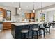 Kitchen featuring a large island, stainless steel appliances, and hardwood cabinetry at 428 Pontiac St, Denver, CO 80220