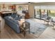 Open concept living room that connects to the kitchen, dining area and outdoor patio at 428 Pontiac St, Denver, CO 80220