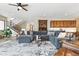 Spacious living room with large sectional, hardwood floors, elegant decor, and access to multiple areas at 428 Pontiac St, Denver, CO 80220