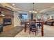 Finished basement with a stone fireplace, dining table, and Star Wars decorations at 27625 E Moraine Dr, Aurora, CO 80016