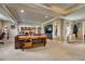 Finished basement with entertaining space including a wet bar, TV, and lounging area at 27625 E Moraine Dr, Aurora, CO 80016