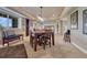 Spacious finished basement with dining table and easy access to the full basement layout at 27625 E Moraine Dr, Aurora, CO 80016