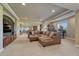 Large basement entertainment area with a sectional sofa, media center, and recessed lighting at 27625 E Moraine Dr, Aurora, CO 80016